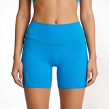 Blue athletic shorts worn by a person on a plain background