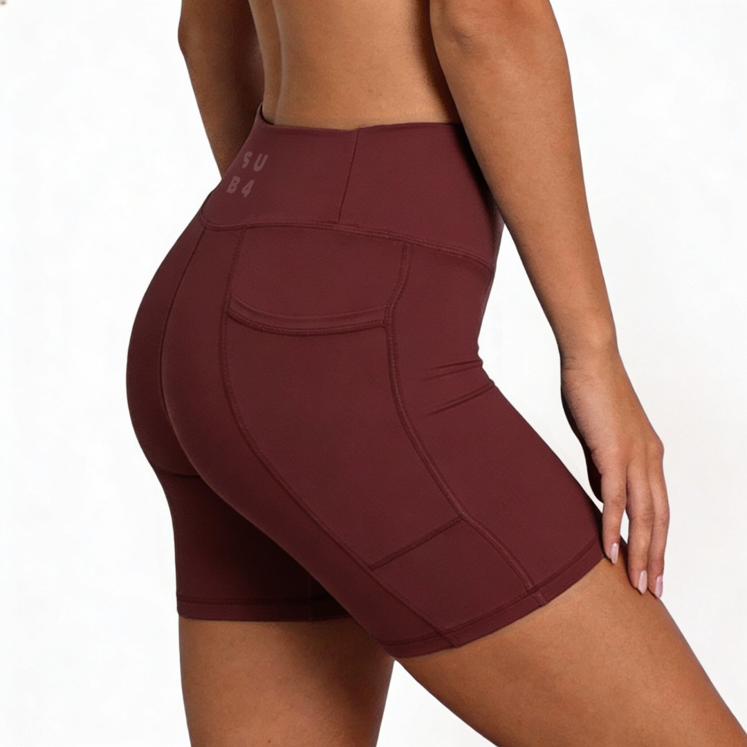 Red maroon athletic shorts with a brand logo on a white background