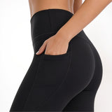 Black athletic yoga pants on a white background